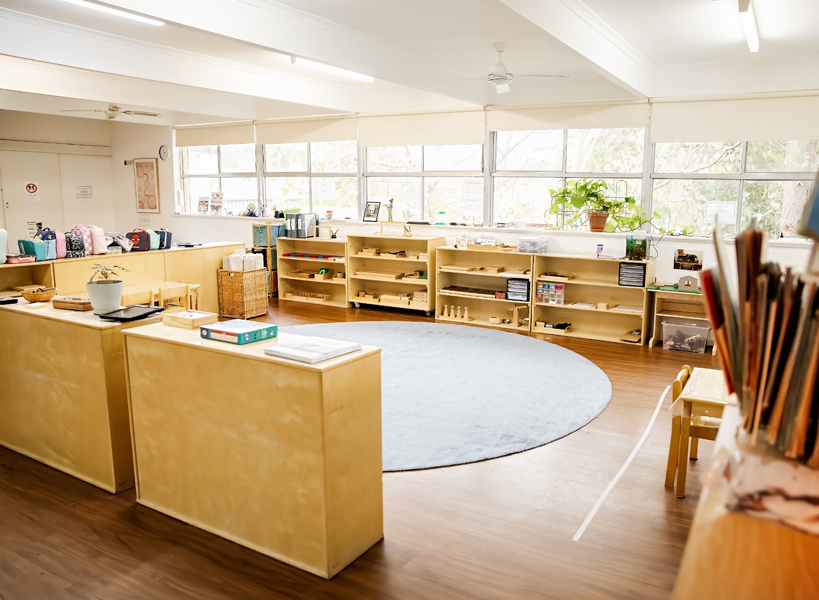 A wide view of a Montessori classroom set up for the day