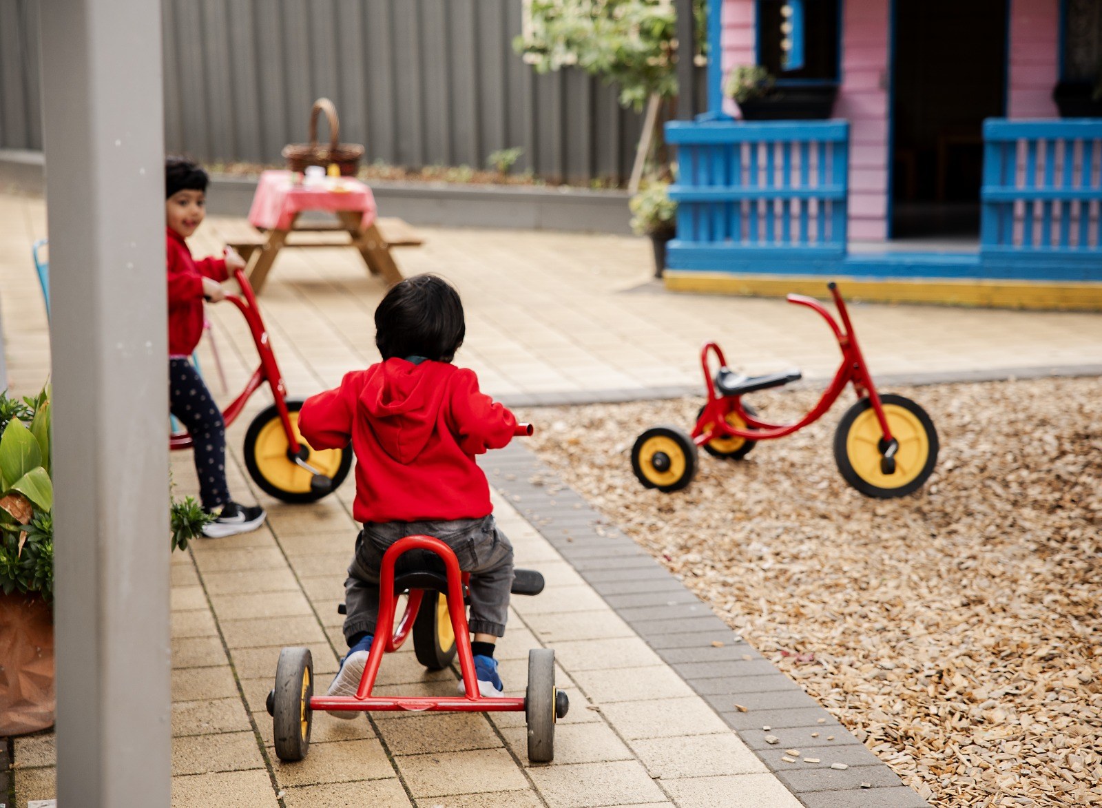 A child riding a tricycle outdoors