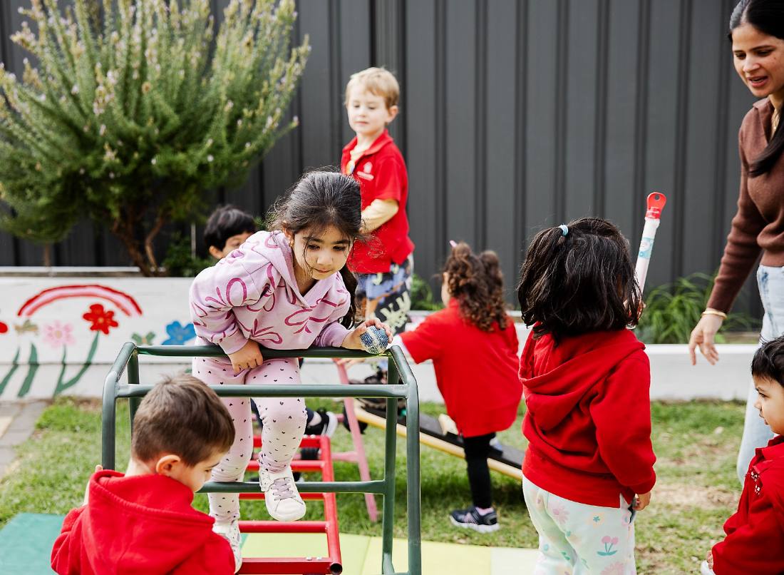 Child washing hands as part of a practical life routine