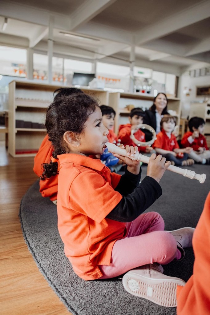 Children playing music together at Hope Valley