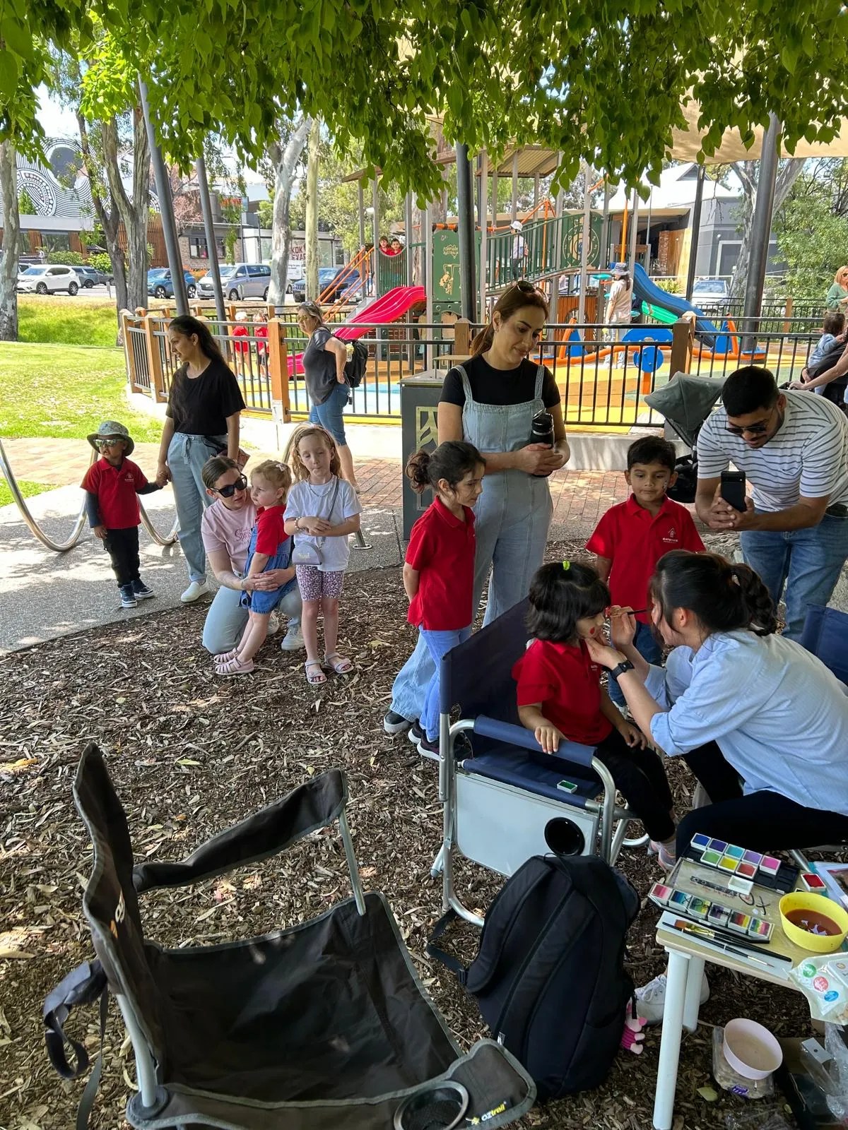 Families and children gathered together at a community park event