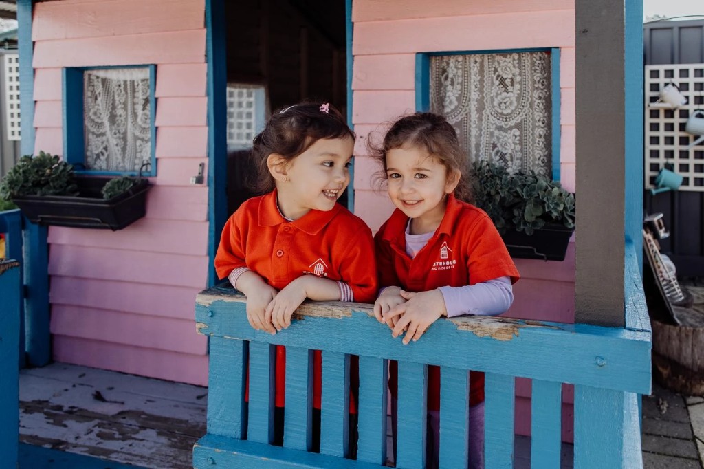 Children at the outdoor playhouse at Hope Valley